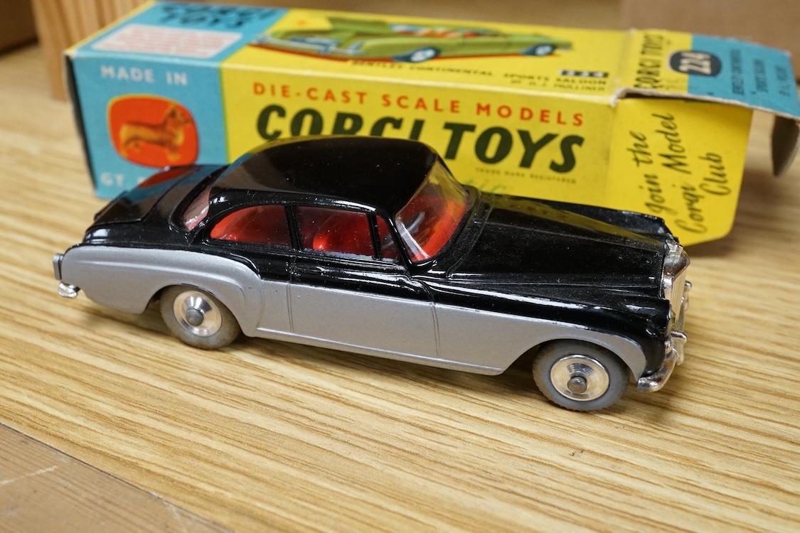 Two boxed Corgi Toys cars; a Bentley Continental Sports Saloon (224) in black and silver livery, with spare wheel, together with a Chevrolet Impala (220) in salmon pink. Condition - good, minor wear and rubbing to boxes.